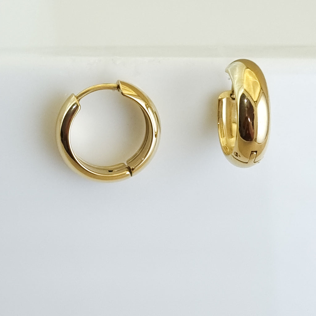 18K gold-plated tubular hoops, waterproof gold earrings, anti-tarnish statement hoops, hypoallergenic luxury jewelry, sculptural gold earrings, thick medium hoop earrings.