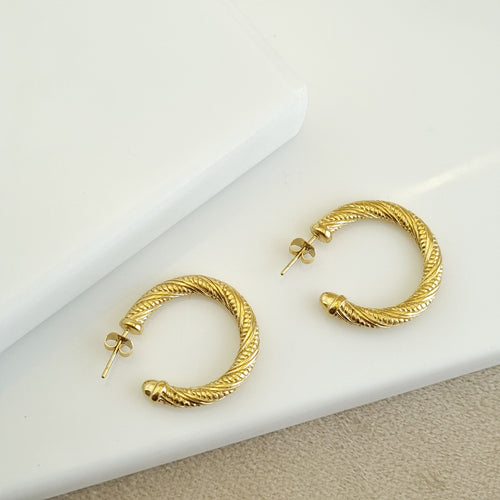 18K gold-plated braided hoops, waterproof gold earrings, anti-tarnish rope hoops, hypoallergenic luxury jewelry, sculptural gold earrings, textured helix hoop earrings.