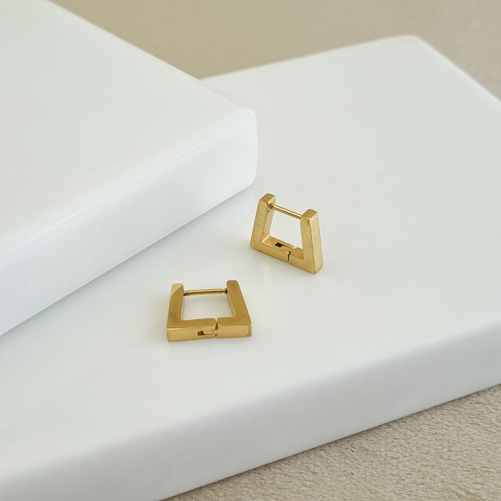 18K gold-plated square hoops, waterproof gold earrings, anti-tarnish geometric huggies, hypoallergenic luxury jewelry, sculptural gold earrings, square hoop earrings.