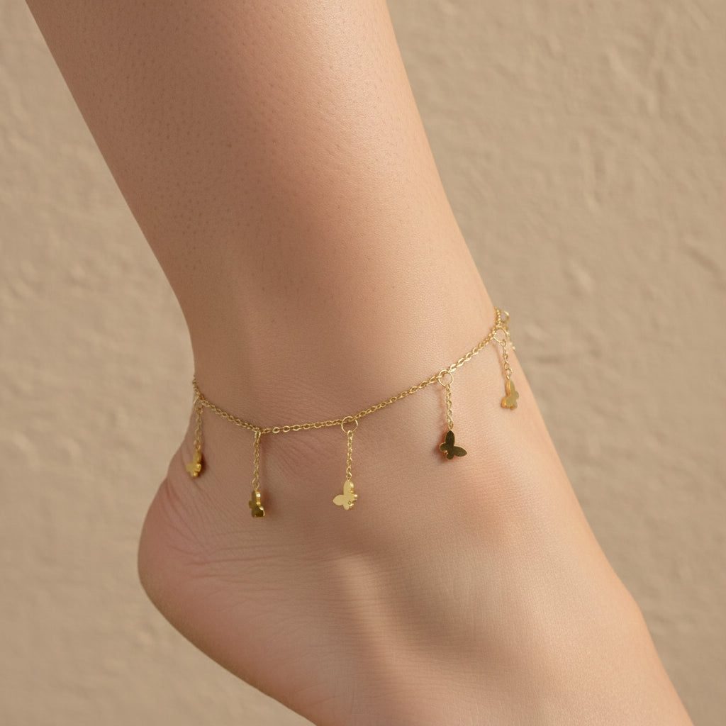 18K gold plated anklet with seven small butterfly charms dangling from a delicate gold cable chain.