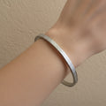 Waterproof silver bangle, anti-tarnish etched cuff, silver-plated geometric bracelet, Treshire Atlas collection.