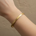 Waterproof infinity bangle, anti-tarnish 18K gold plated cuff, etched gold bracelet, symbolic jewelry, Treshire Infinity collection.