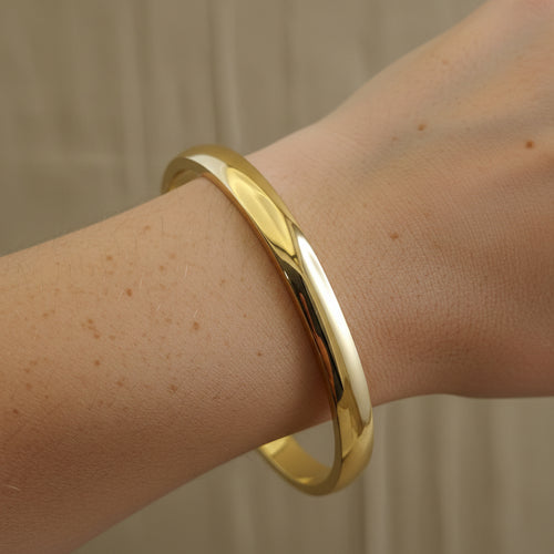 Waterproof gold bangle, anti-tarnish high-polish cuff, 18K gold plated smooth bracelet, Treshire Aurelia collection, mirror-finish jewelry.