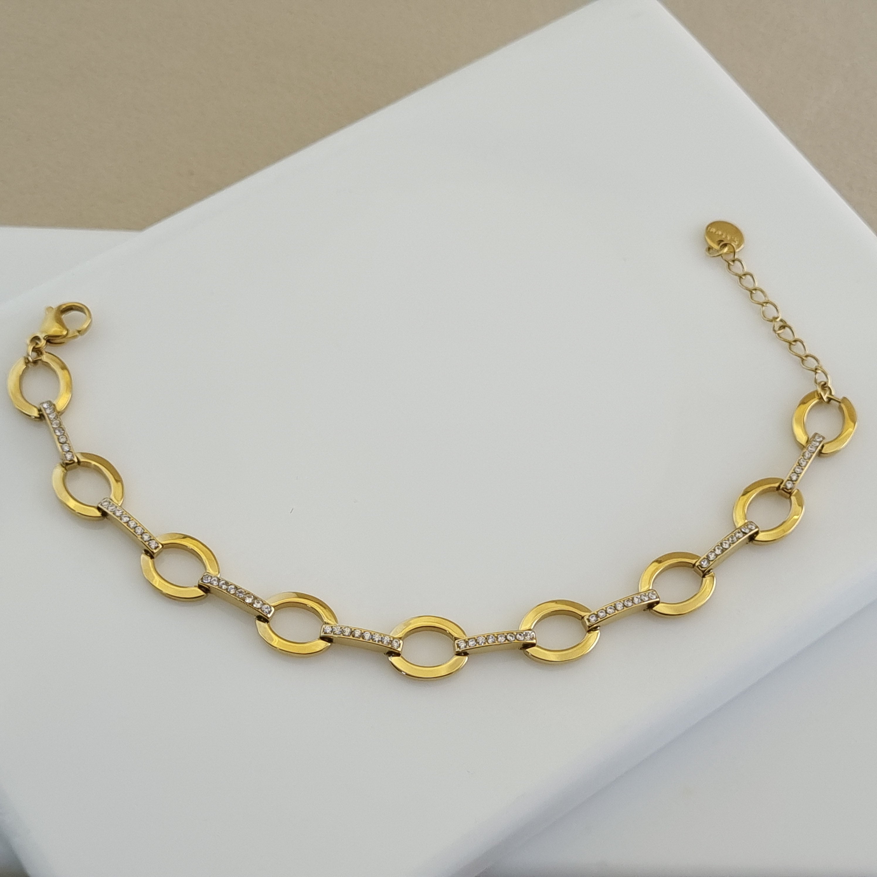 Modern gold bracelet for women, geometric crystal jewelry, durable gold plated accessories, hypoallergenic link bracelet, luxury gold gift for her.