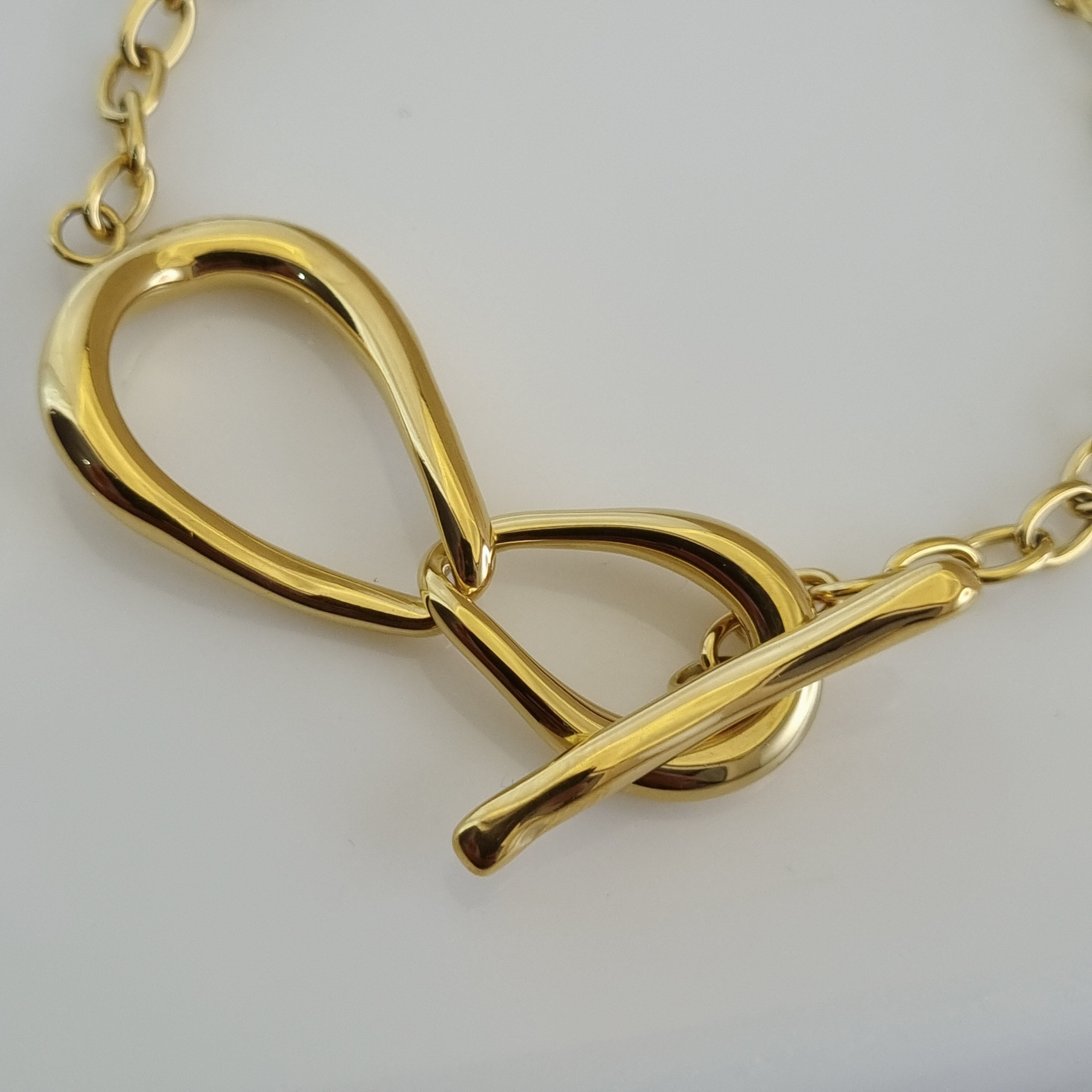 Bold gold bracelet for women, toggle closure jewelry, modern architectural bracelet, durable gold plated accessories, hypoallergenic gold jewelry.