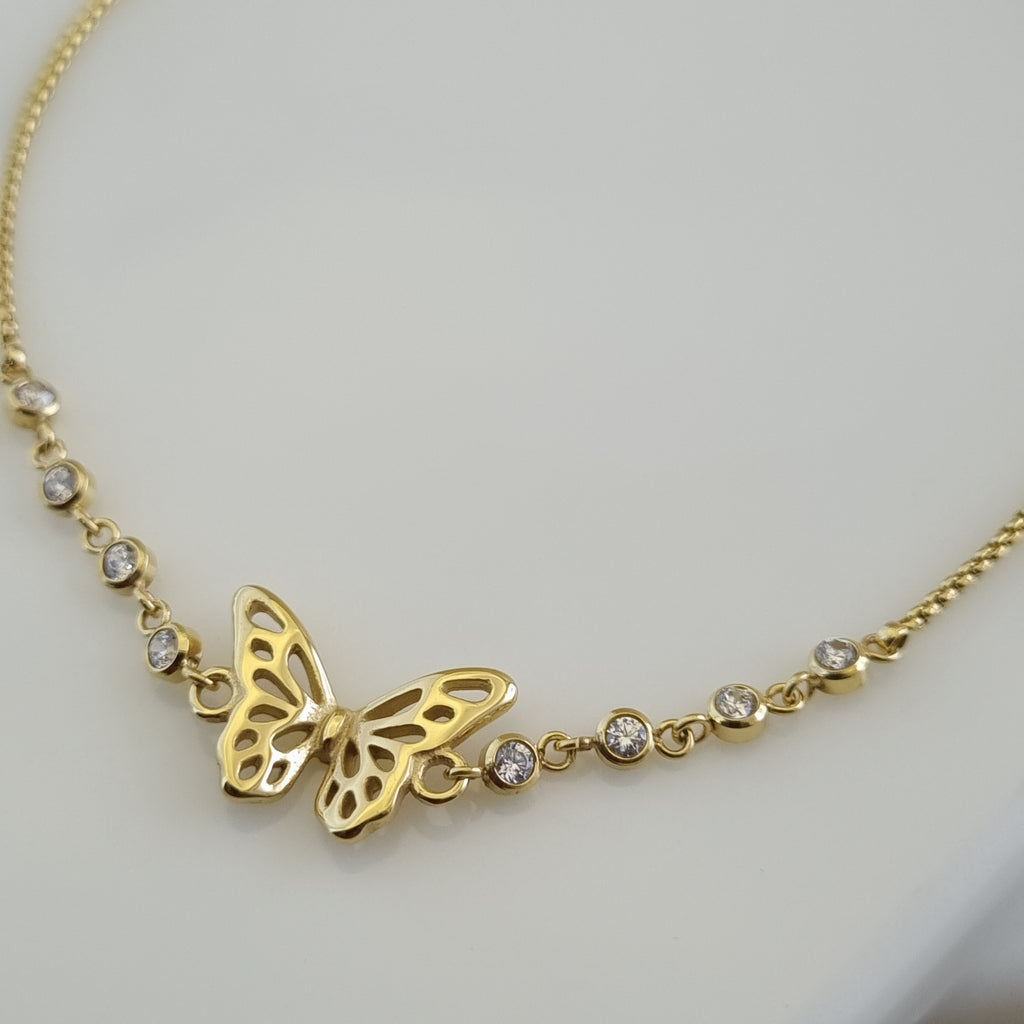 18K gold plated anklet featuring a butterfly charm and several bezel-set crystals on a delicate micro-box chain.
