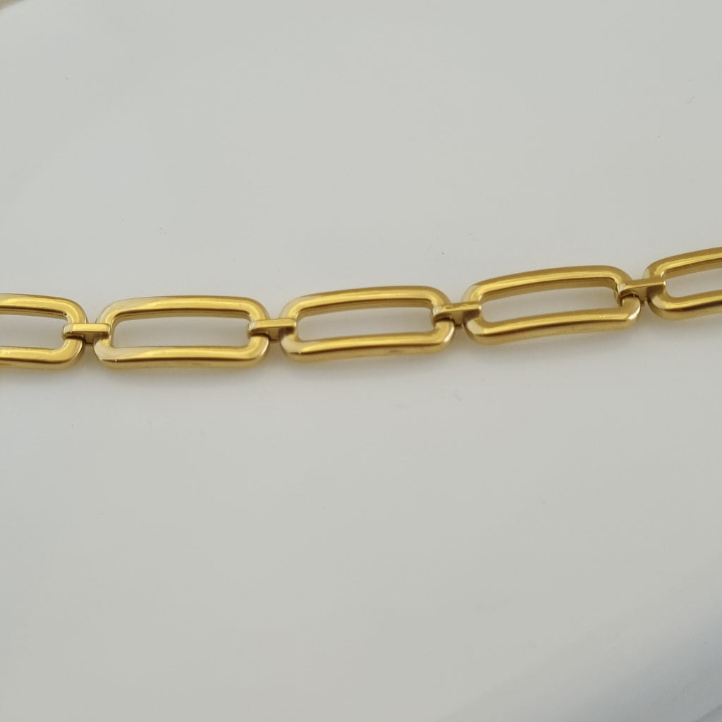 Treshire 18K gold plated Everyday Golden Links bracelet with elongated rectangular links displayed on a white marble surface.