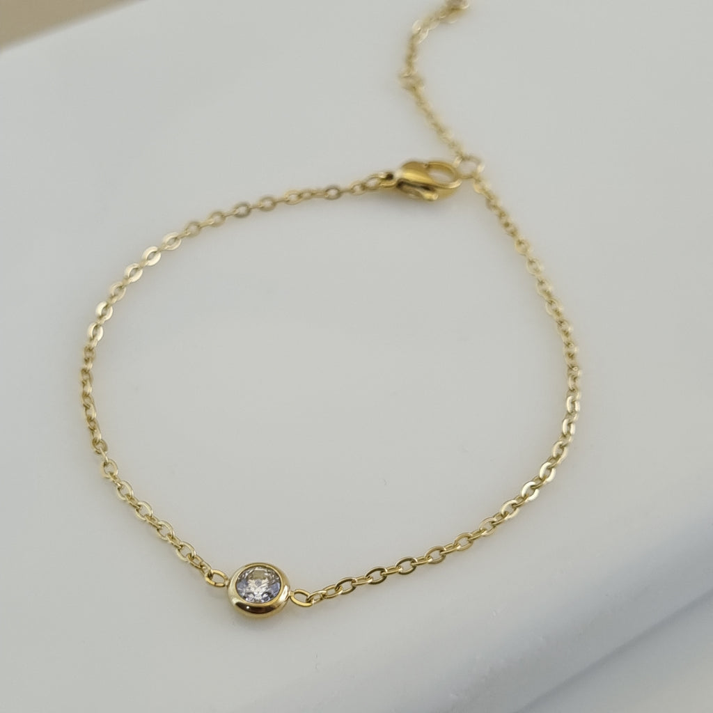 Treshire 18K gold plated Everyday Solitaire bracelet with a single bezel-set crystal on a fine gold chain.