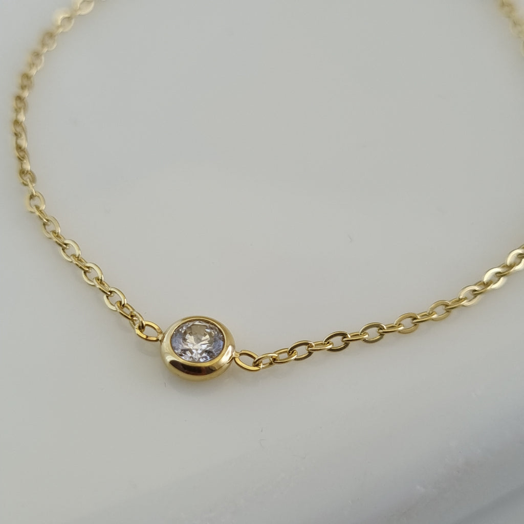 Treshire 18K gold plated Everyday Solitaire bracelet with a single bezel-set crystal on a fine gold chain.