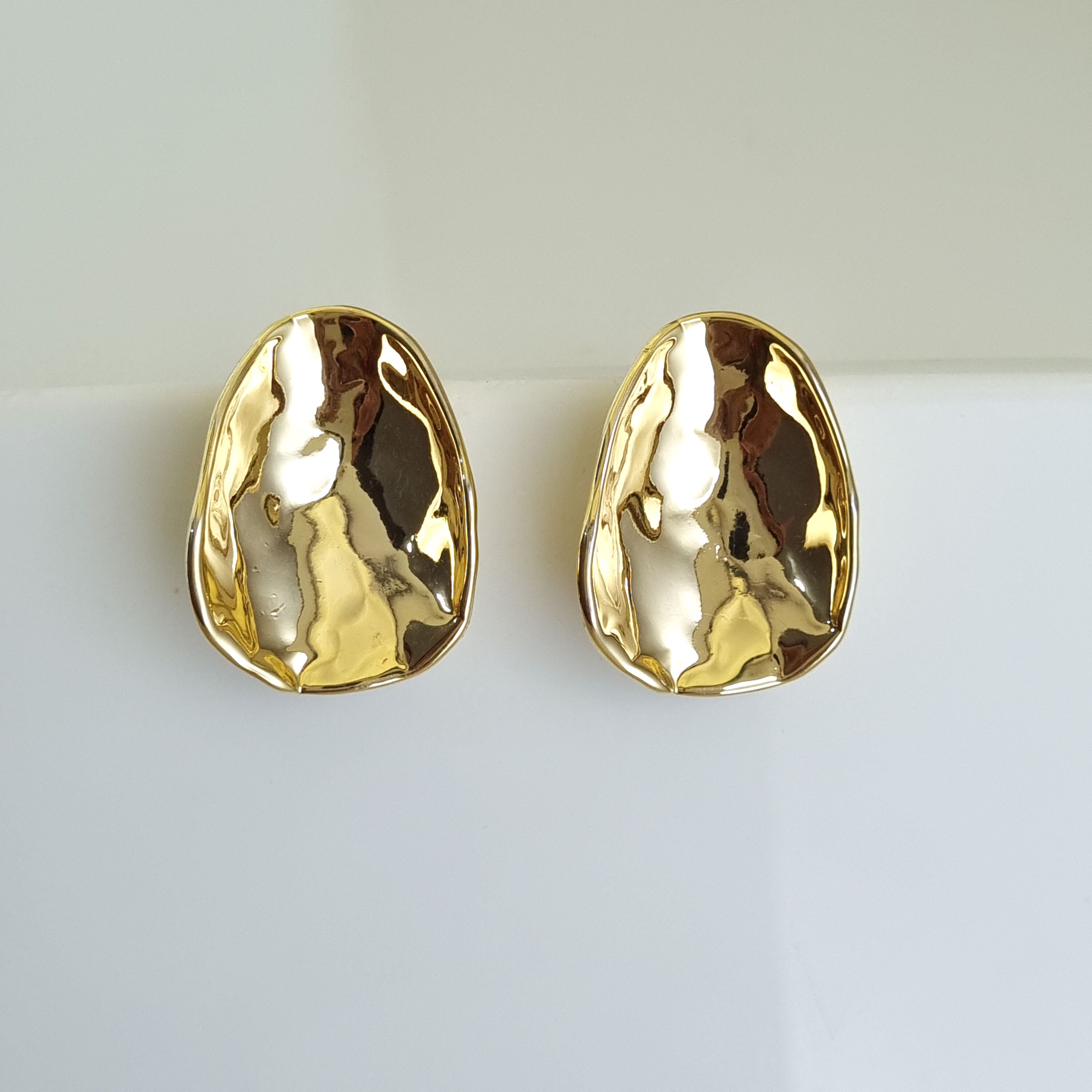 18K gold-plated hammered earrings, waterproof gold studs, anti-tarnish statement earrings, hypoallergenic organic jewelry, sculptural gold studs, textured gold jewelry.
