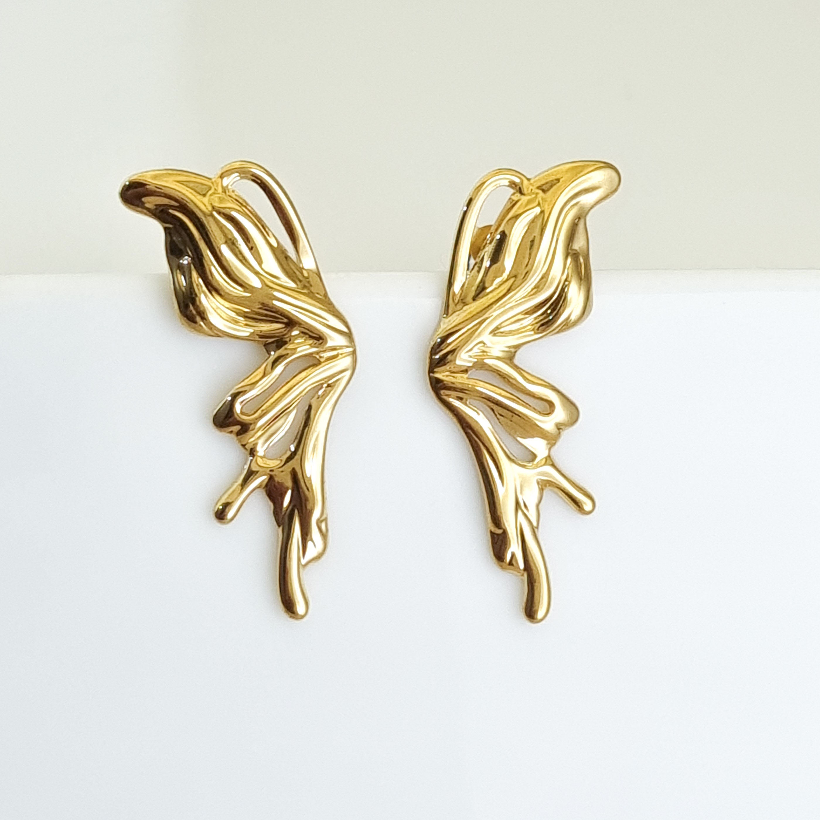 18K gold-plated sculptural earrings, waterproof gold ear climbers, anti-tarnish flame earrings, hypoallergenic avant-garde jewelry, organic gold studs, architectural gold earrings.
