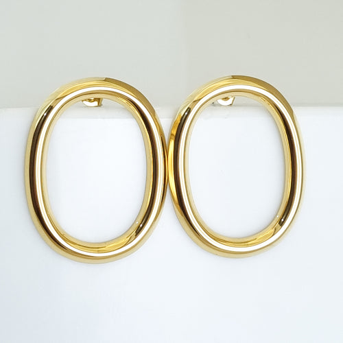 18K gold-plated oval hoops, waterproof gold earrings, anti-tarnish statement hoops, hypoallergenic luxury jewelry, sculptural gold earrings, vertical oval hoop earrings.