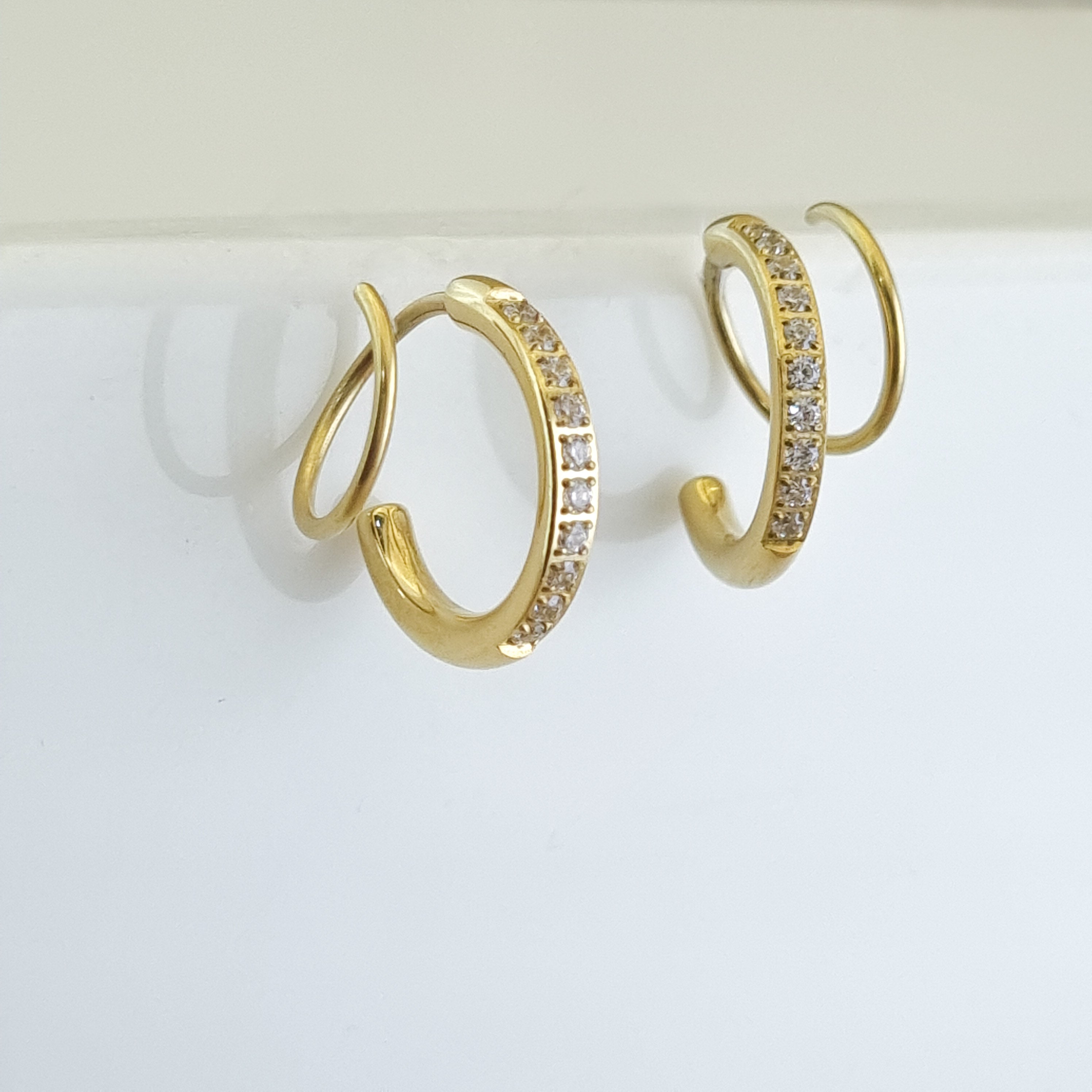 18K gold-plated pavé hoops, waterproof crystal earrings, anti-tarnish diamond huggies, hypoallergenic luxury jewelry, sculptural gold hoops, shimmering micro-pavé earrings.